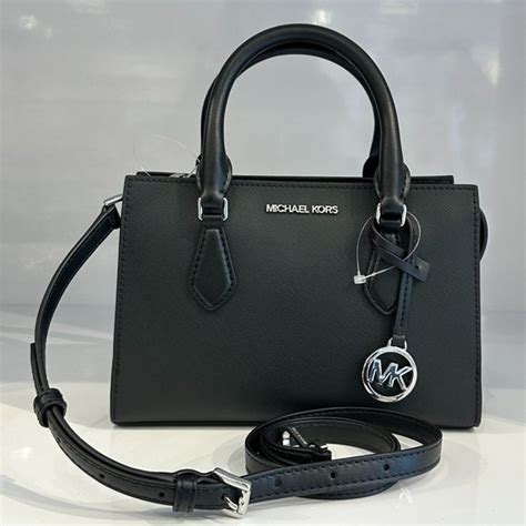 michael kors tasche imitat|Michael Kors opened satchel purse.